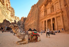 Tourists gather in front of the treasury site in the ancient city of Petra, Jordan July 2, 2021. 