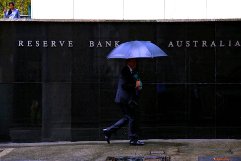 Pedestrians walk past the Reserve Bank of Australia building in central Sydney, Australia, March 7, 2017.    