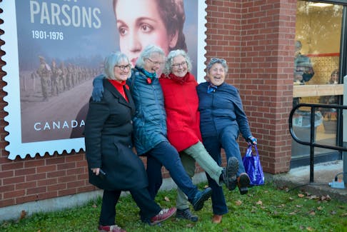 At the unveiling of a stamp commemorating Canadian war heroine Mona Parsons, Women of Wolfville representatives Ramona Jennex, Wendy Elliott, Andria Hill-Lehr, and Verlie Wile kick up a foot, recreating the pose depicted in the statue The Joy is Almost Too Much to Bear. KIRK STARRATT