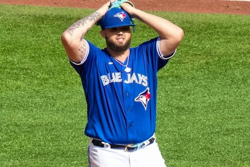 Toronto Blue Jays starting pitcher Alek Manoah reacts after hitting Los Angeles Angels' Taylor Ward with a pitch.