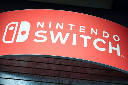 Signage for the Nintendo Switch is seen at a GameStop in Manhattan, New York, U.S., December 7, 2021.