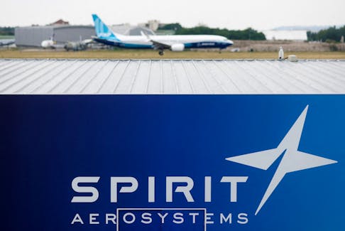 A Boeing 737 MAX-10 lands over the Spirit AeroSystems logo during a flying display at the 54th International Paris Air Show at Le Bourget Airport near Paris, France, June 22, 2023.