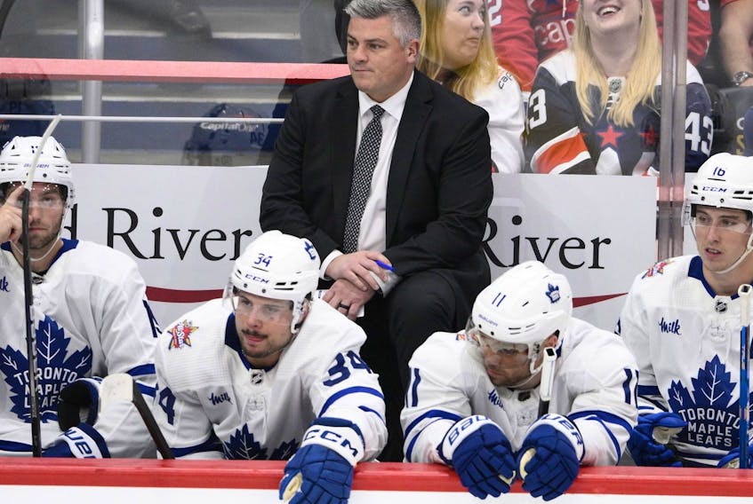 Toronto Maple Leafs head coach Sheldon Keefe looks on from the bench during a game.