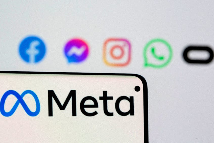 Facebook's new rebrand logo Meta is seen on smartphone in front of displayed logo of Facebook, Messenger, Instagram, Whatsapp and Oculus in this illustration picture taken October 28, 2021.
