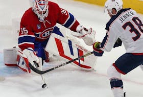 Canadiens goaltender Sam Montembeault keeps his eye on the puck with Blue Jackets' Boone Jenner lurking during a agme at the Bell Centre in October.