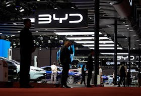 Security guards stand at the BYD booth at the Auto Shanghai show, in Shanghai, China April 19, 2023.