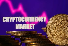 Representations of cryptocurrencies are seen in front of displayed words "Cryptocurrency market" and decreasing stock graph in this illustration taken November 10, 2022.