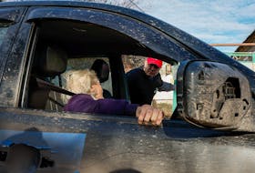 Yevhen Tkachov, 54 year-old, volunteer and local citizen, evacuates Nelia, 85 year-old, to a shelter for internally displaced people (IDPs) from her house in a village near Chasiv Yar, amid Russia's attack on Ukraine, in Donetsk region, Ukraine November 8, 2023.