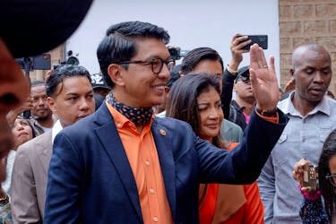 Madagascar's President and a presidential candidate Andry Rajoelina flanked by his wife Mialy Rajoelina as he arrives to cast his ballot at a polling station, during the presidential election in Ambatobe, Antananarivo, Madagascar November 16, 2023.