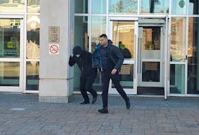 Woodstock RCMP officer Osama Ibrahim exits the Saint John Law Courts on Thursday, after day four of his trial on five charges for assault, sexual assault and breach of trust.  - Andrew Bates, Local Journalism Initiative Reporter, Telegraph-Journal