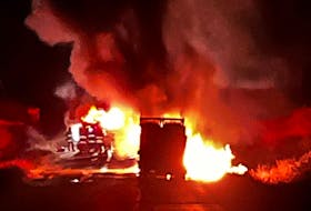 A transport truck carrying a large number of oxygen tanks was caught on fire on Bay d'Espoir Highway on Nov. 30. - Contributed