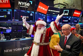 Macy's Santa Claus appears on the trading floor to celebrate the 97th Macy's Thanksgiving Day Parade at the New York Stock Exchange (NYSE) in New York City, U.S., November 22, 2023. 