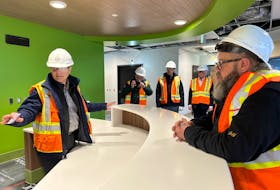 Michael Delli Colli (far left), senior project manager for the new Mental Health and Addictions Centre construction, gives a tour of the nurses’ station. To the far right is Provincial Recovery Council for Mental Health and Addictions chair and U-Turn Drop-in Centre executive director Jeff Bourne. To Bourne’s immediate left in the background is Health Minister Tom Osborne. -Juanita Mercer/SaltWire