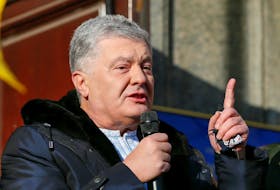 Ukrainian former President Petro Poroshenko, who is suspected of high treason by financing pro-Russian separatists in eastern Ukraine while in office in 2014-2015, addresses his supporters outside a court building before a hearing in Kyiv, Ukraine January 19, 2022.