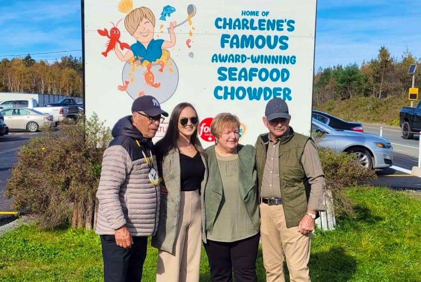 From left, Rod Googoo, Bonnie MacNeil, Charlene MacNeil and Dan Joseph MacNeil stand outside the new sign to Charlene's Family Restaurant in Whycocomagh. The eatery relocated to the site of the former Auld Brass Door Restaurant & Bar on Trans-Canada Highway 105, about a kilometre east of its former location, in October. CONTRIBUTED
