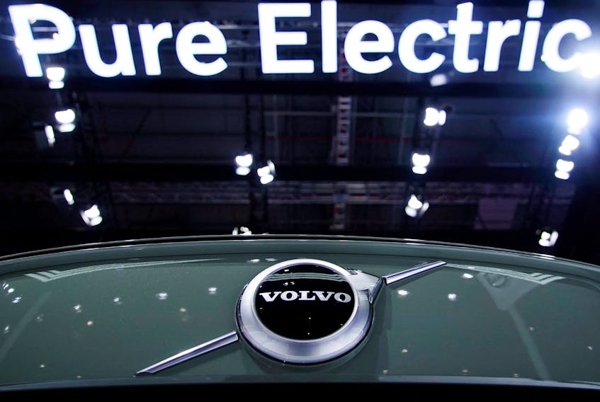 A Pure Electric sign is seen above a Volvo vehicle displayed during a media day for the Auto Shanghai show in Shanghai, China April 20, 2021.