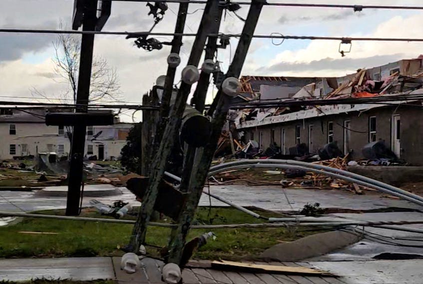 A downed light pole and damaged houses following a possible tornado at Clarksville,Tennessee, U.S., December 9, 2023, in this screen grab taken from a social media video. Noemi Canales/via REUTERS