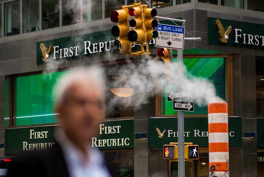 A man walks near one of the First Republic Bank branches in New York, U.S. April 28, 2023.