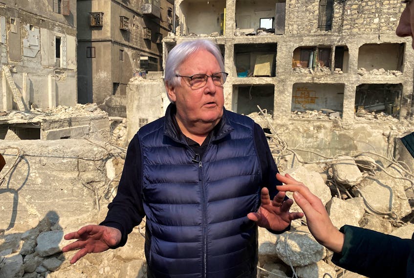 United Nations (UN) Under-Secretary-General for Humanitarian Affairs and Emergency Relief Coordinator Martin Griffiths gestures as he stands near damaged buildings, in the aftermath of a deadly earthquake, in Aleppo, Syria February 13, 2023.