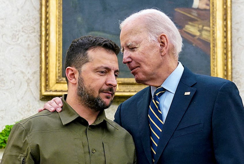 Ukrainian President Volodymyr Zelenskiy is embraced by U.S. President Joe Biden in the Oval Office of the White House in Washington, September 21, 2023.