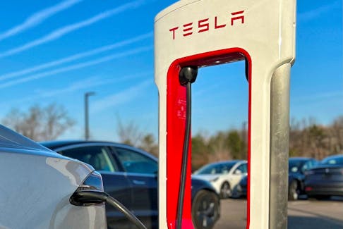Tesla Supercharger station at a Tesla store in Ann Arbor, Michigan, U.S., December 7, 2023. 