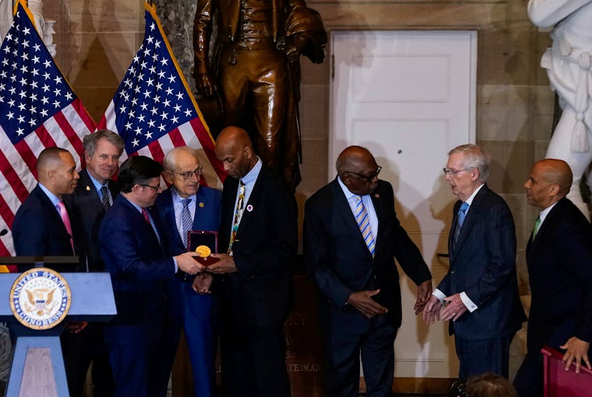 Larry Doby, Jr., accepts the Congressional Gold Medal posthumously honoring his father, Major League Baseball player, civil rights activist and World War II veteran, Lawrence Eugene “Larry” Doby, during a ceremony in Statuary Hall at the U.S. Capitol in Washington, U.S., December 13, 2023.
