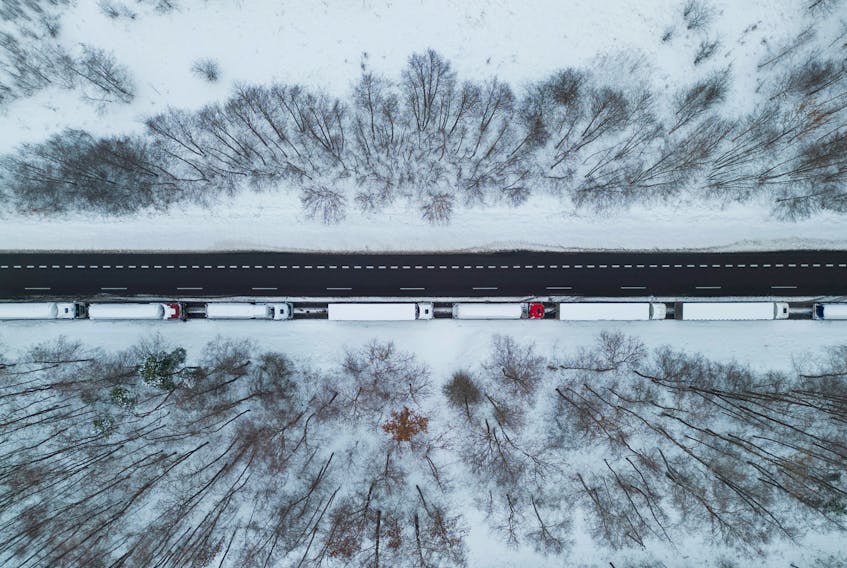 Trucks line up in a long queue to cross the Polish-Ukrainian border at the Dorohusk-Jagodzin crossing, in Ludwinow, Poland, December 4, 2023.
