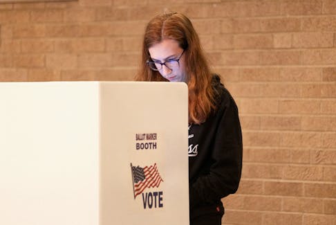 A voter fills out their ballot as voters in Ohio decide whether to enshrine abortion protections into the state constitution, in Columbus, Ohio, U.S. November 7, 2023.