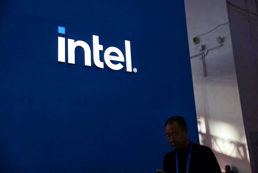 A man walks past the Intel logo at its booth during the first China International Supply Chain Expo (CISCE) in Beijing, China November 28, 2023.