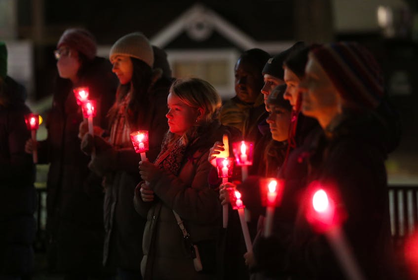 Participants gather for a vigil and walk to honour the 14 lives lost during the Montreal Massacre and those who are still impacted by gender-based violence each day. on the The National Day of Remembrance and Action to End Gender-based Violence  in Victoria Park in Halifax Tuesday December 6, 2022. The event was sponsored by the Avalon Sexual Assault Centre and the Halifax Public Library..The  vigil was followed by a walk to the Halifax Central Library for guest speakers, food, and time for reflection.

TIM KROCHAK PHOTO