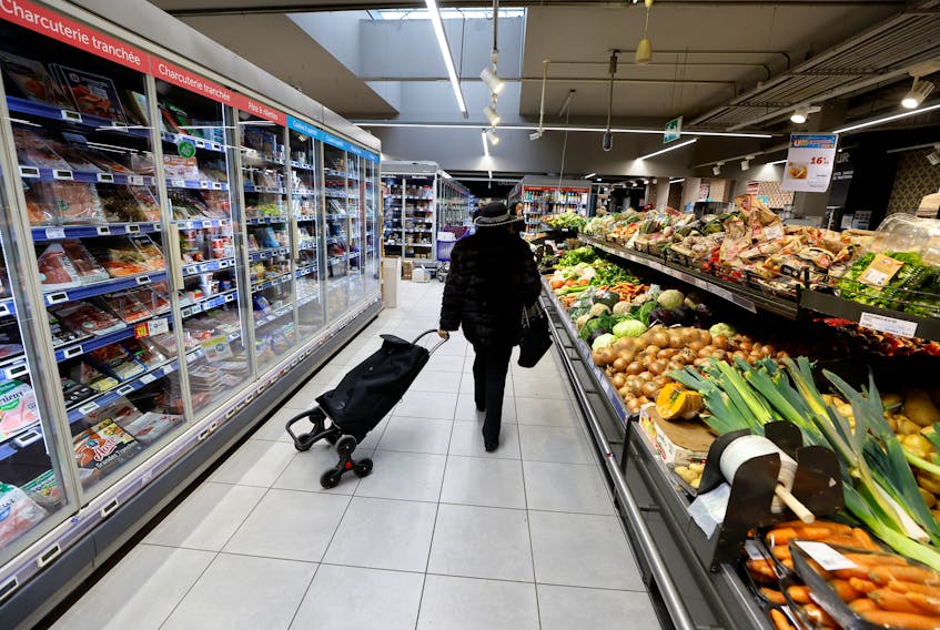 A customer shops in a supermarket in Nice, France, March 1, 2023.   