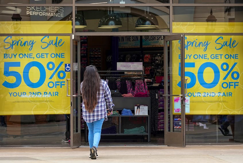 Sale signs are placed to greet shoppers at a retail store in Carlsbad, California, U.S., May 25, 2023.