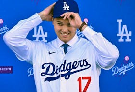 Japanese baseball player Shohei Ohtani attends a press conference on his presentation after signing a ten-year deal with the Los Angeles Dodgers.