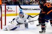  The Edmonton Oilers Ryan Nugent-Hopkins’ (93) shot gets past the Tampa Bay Lightning’s goalie Andrei Vasilevskiy (88) during third period NHL action at Rogers Place, in Edmonton Thursday Dec. 14, 2023. The Lightning won 7-4.