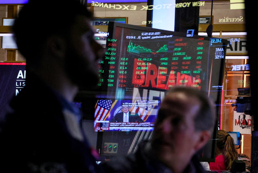 Traders react as Federal Reserve Chair Jerome Powell is seen delivering remarks on a screen, on the floor of the New York Stock Exchange (NYSE) in New York City, U.S., May 3, 2023. 