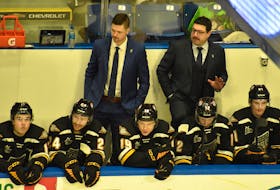 Cape Breton Eagles coaches Nick MacNeil, left, and Louis Robitaille chat behind the team’s bench during a Quebec Maritimes Junior Hockey League game at Centre 200 in Sydney earlier this year. General manager Sylvain Couturier says he wants to improve his team at the upcoming winter trade period, which begins on Sunday. JEREMY FRASER/CAPE BRETON POST