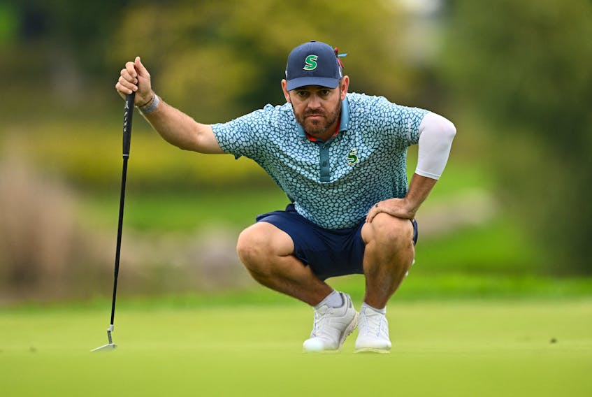 Sep 22, 2023; Sugar Grove, Illinois, USA; Louis Oosthuizen lines up a putt on the 14th green during the first round of the LIV Golf Chicago golf tournament at Rich Harvest Farms. / Jamie Sabau-USA TODAY Sports/File Photo