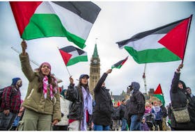 Palestinian supporters on Parliament Hill Sunday called for a ceasefire and for Prime Minister Justin Trudeau to do more to support their cause. 
Ashley Fraser/Postmedia