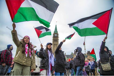 Palestinian supporters on Parliament Hill Sunday called for a ceasefire and for Prime Minister Justin Trudeau to do more to support their cause. 
Ashley Fraser/Postmedia