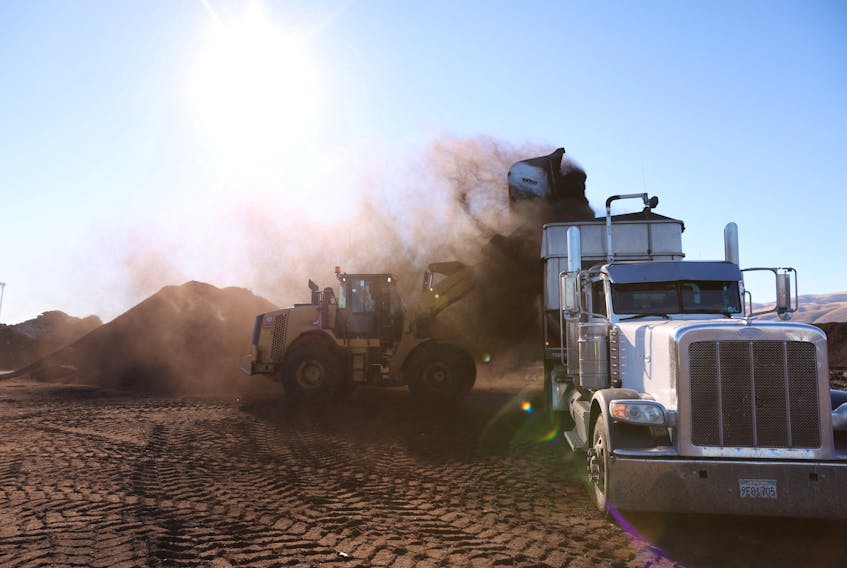 Fresh compost made from food scraps and green waste is loaded onto a truck before being sent to a farm at Recology Blossom Valley Organics North near Vernalis, California, U.S., November 10, 2022. 