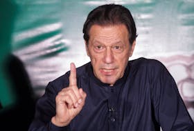 Pakistan's former Prime Minister Imran Khan, gestures as he speaks to the members of the media at his residence in Lahore, Pakistan May 18, 2023.