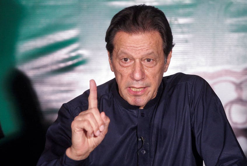 Pakistan's former Prime Minister Imran Khan, gestures as he speaks to the members of the media at his residence in Lahore, Pakistan May 18, 2023.