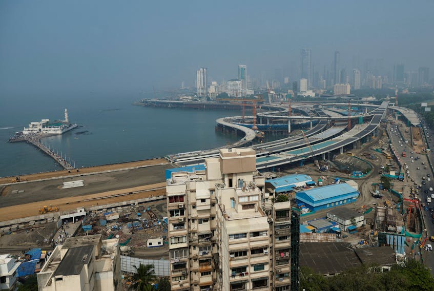 A general view of residential buildings amidst the coastal road construction work in Mumbai, India, December 1, 2023.