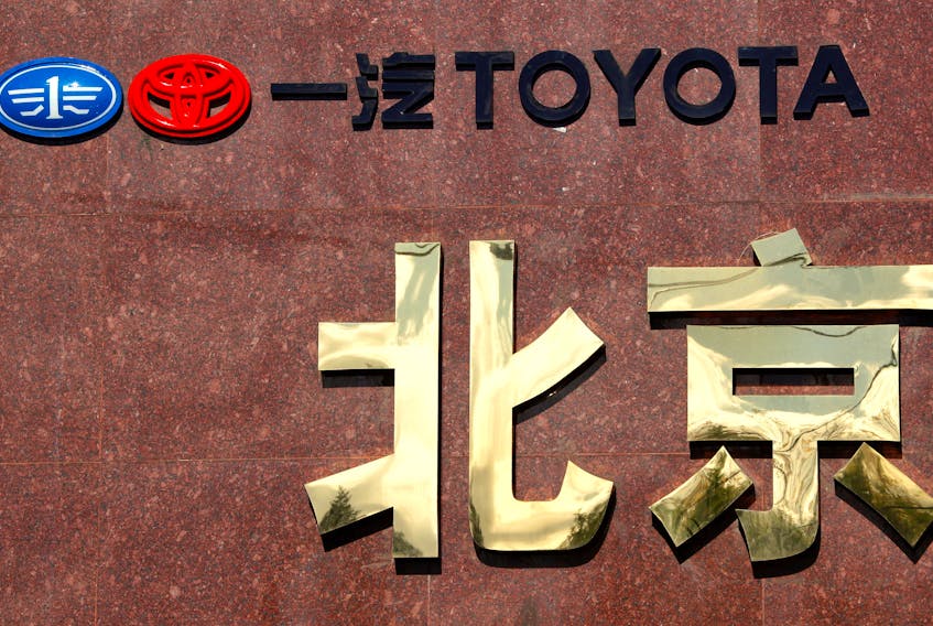 A sign is seen outside a Tianjin Faw Toyota Motor Co. Ltd showroom, a joint venture between China's Tianjin FAW Xiali Automobile Co Ltd and Japan's automaker Toyota Motor Corp, in central Beijing October 9, 2012.