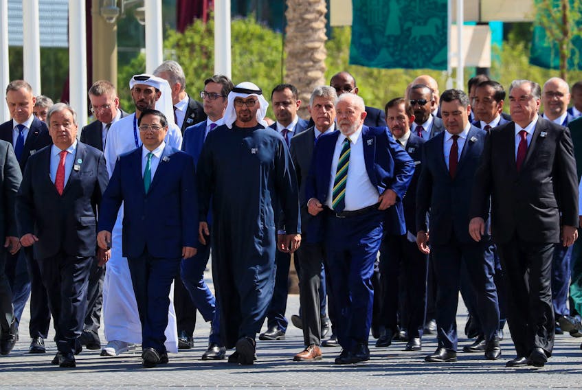 President of the United Arab Emirates Sheikh Mohamed bin Zayed Al Nahyan walks with Brazil's President Luiz Inacio Lula da Silva, alongside other world leaders and delegates, at Dubai's Expo City ahead of the World Climate Action Summit during the United Nations Climate Change Conference (COP28) in Dubai, United Arab Emirates, December 1, 2023.