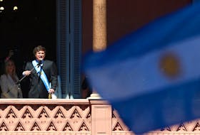Argentina's President Javier Milei addresses supporters gathered outside Casa Rosada after his swearing-in ceremony, in Buenos Aires, Argentina December 10, 2023.
