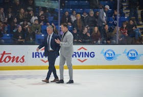 Charlottetown Islanders general manager and head coach Jim Hulton, left, and assistant coach Kevin Henderson walk off the ice during a recent Quebec Maritimes Junior Hockey League game at Eastlink Centre in Charlottetown. Hulton has been named head coach of Team White for the 2024 Kubota Canadian Hockey League (CHL)/National Hockey League (NHL) Top Prospects Game in Moncton, N.B., on Jan. 24. Jason Simmonds • The Guardian