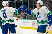  Brock Boeser gets a congrats from JT Miller after scoring his 24th goal of the season against the Dallas Stars.