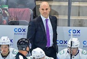 Apr 13, 2023; Tempe, Arizona, USA;  Vancouver Canuck head coach Rick Tocchet watches game action in the first period against the Arizona Coyotes at Mullett Arena. Mandatory Credit: Matt Kartozian-USA TODAY Sports