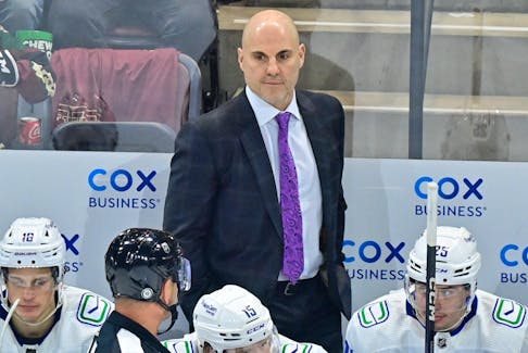 Apr 13, 2023; Tempe, Arizona, USA;  Vancouver Canuck head coach Rick Tocchet watches game action in the first period against the Arizona Coyotes at Mullett Arena. Mandatory Credit: Matt Kartozian-USA TODAY Sports